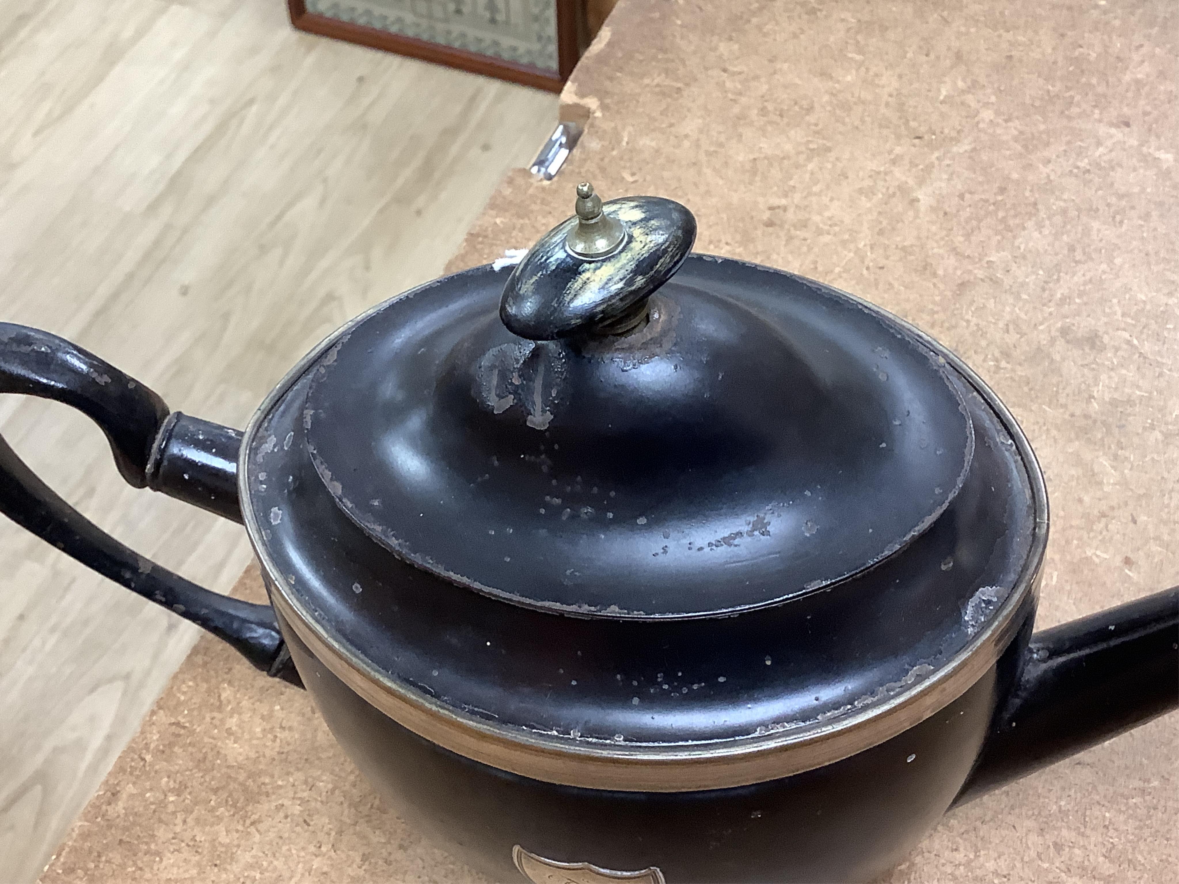A George III silver and Old Sheffield plate mounted toleware teapot and a pair of red japanned toleware wine coasters, teapot 28cm wide (3)